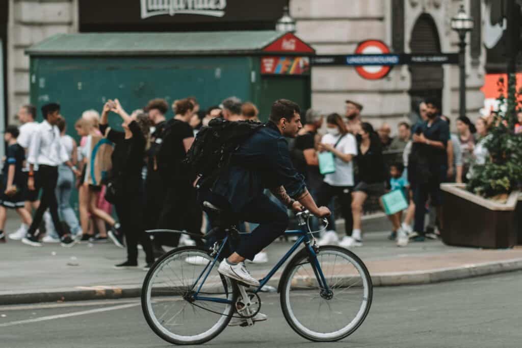 A man riding his bicycle to work